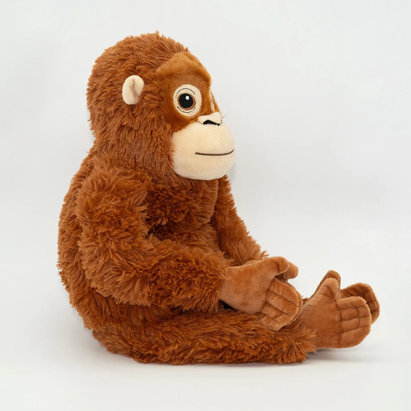 Plush monkey toy on a white background