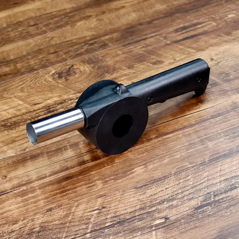 Black metal component on a wooden surface