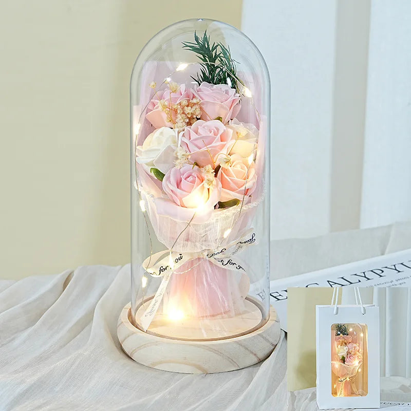 Artificial soap flower under acrylic dome