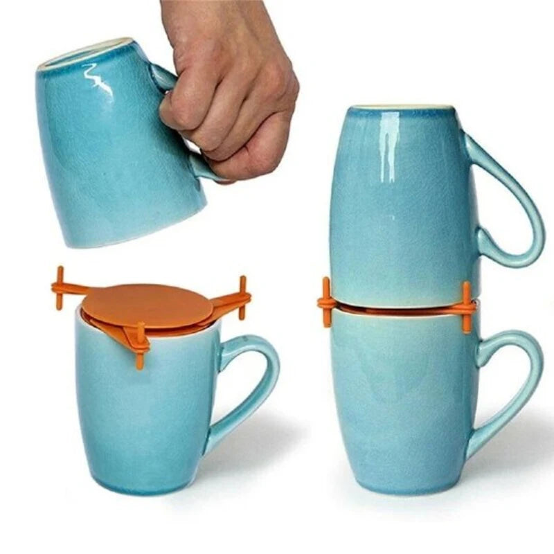 Two blue mugs with orange clips and lids on a white background