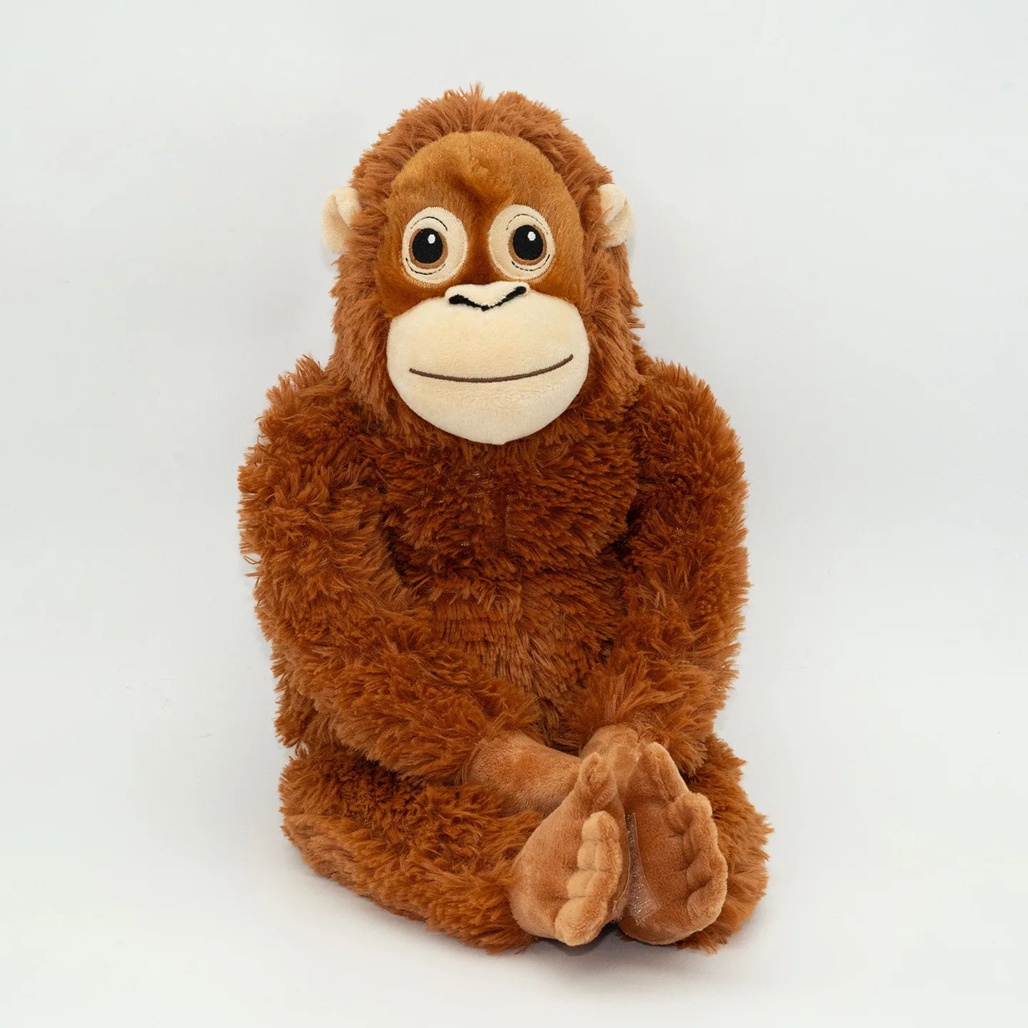 Plush monkey toy on a white background