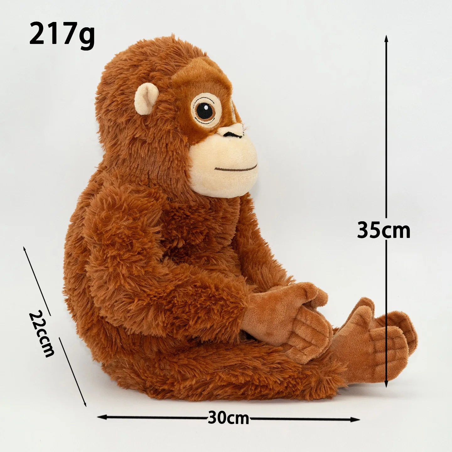 Stuffed monkey toy with measurements on a white background