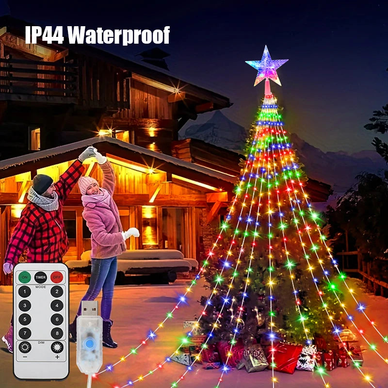 Colorful LED Christmas tree with star light on a snowy night, family in the background, and remote control.