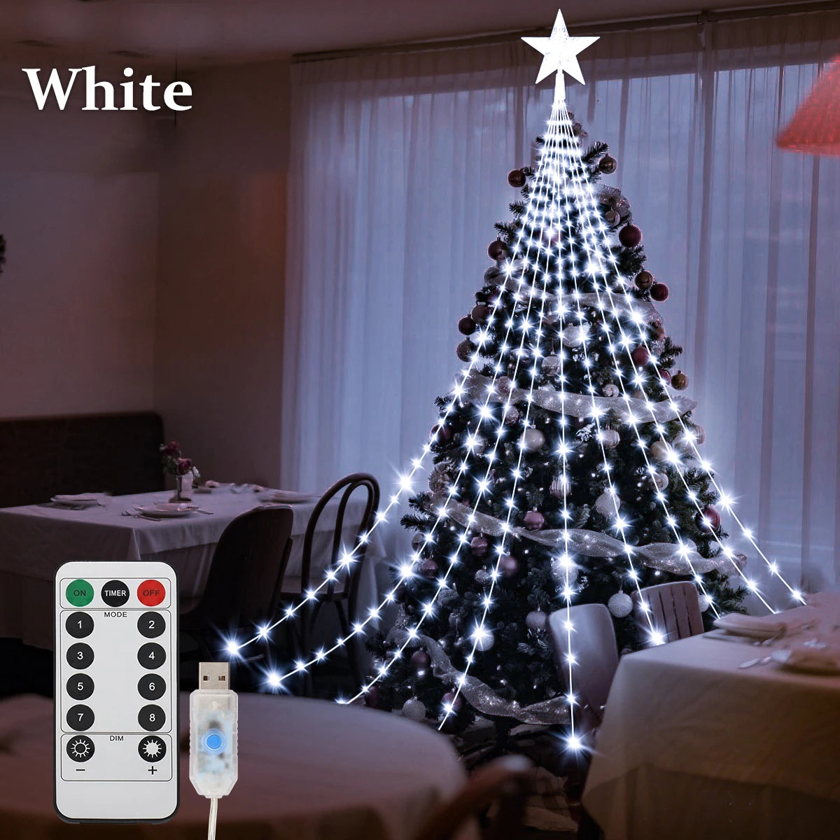 Decorative Christmas tree with white string lights and remote control in a room setting.